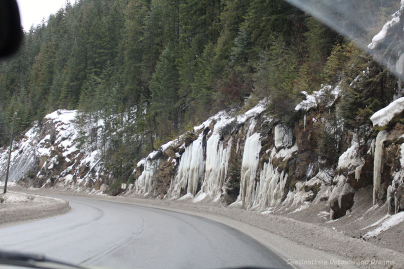 Frozen waterfalls alongside highway in British Columbia mountains