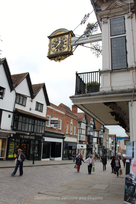 Gilt oak 17th century clock hanging over Guildford high street