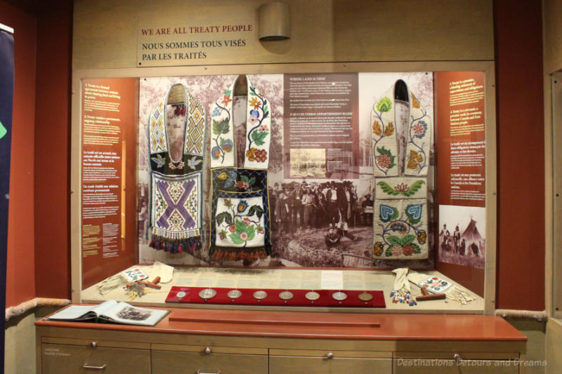 Exhibit at Manitoba Museum with artifacts and written information about treaties with First Nations peoples