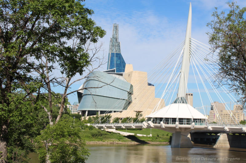 Canadian Museum for Human Rights alongside the Esplanade Riel pedestrian bridge in Winnipeg, Manitoba