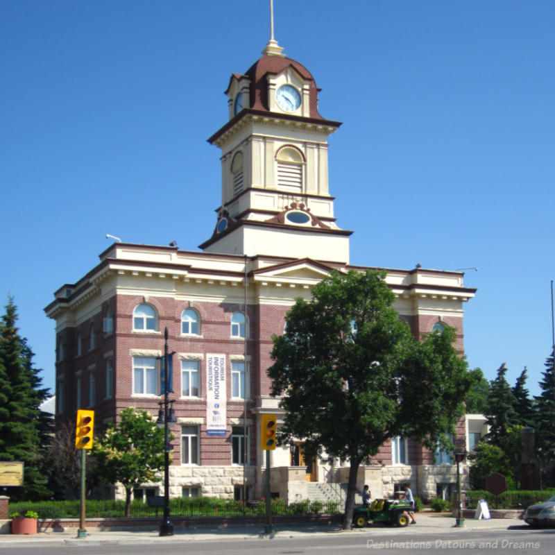 Red brick and white stone City Hall with clock tower