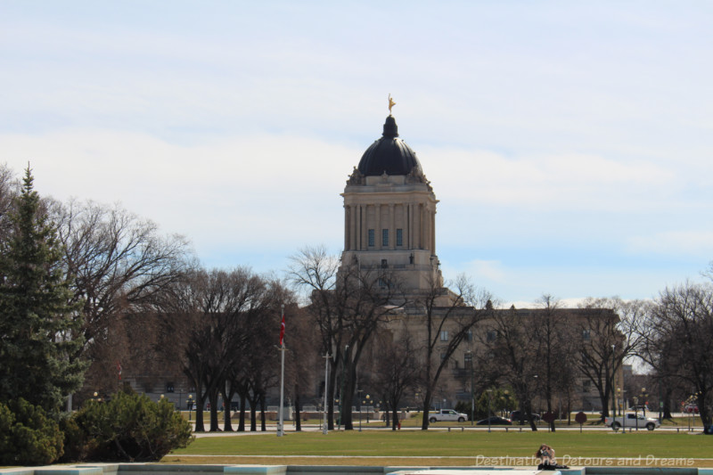 Neoclassical Manitoba Legislative Building behind Memorial Park in Winnipeg