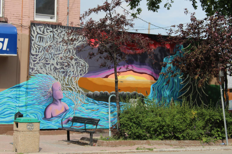 Multi-coloured stylized mural representing Canada's varied landscape