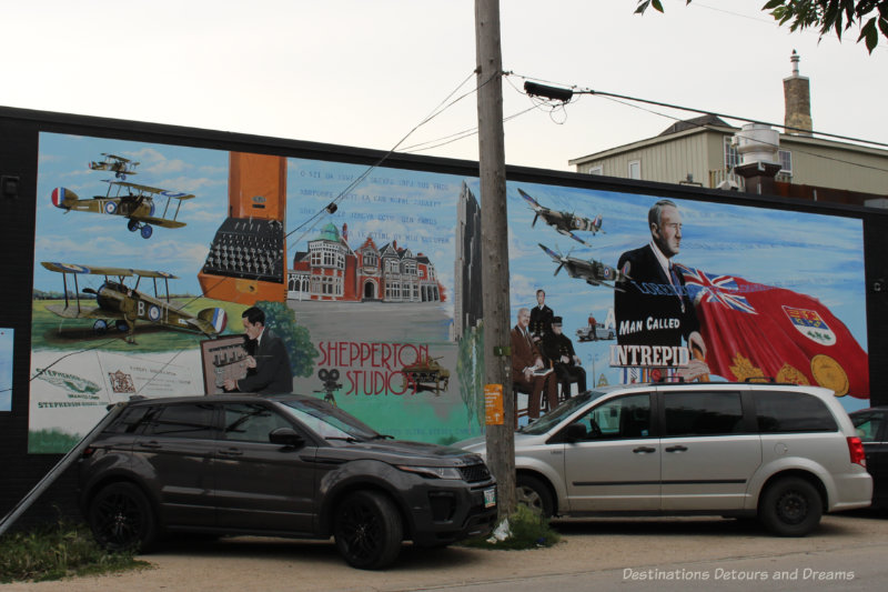 A mural showing a collage of items reflecting the life of Sir William Stephenson