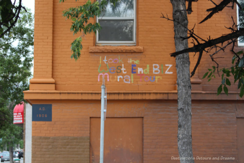 The words I took the West End BIZ mural tour written in many colours on the wall of a building