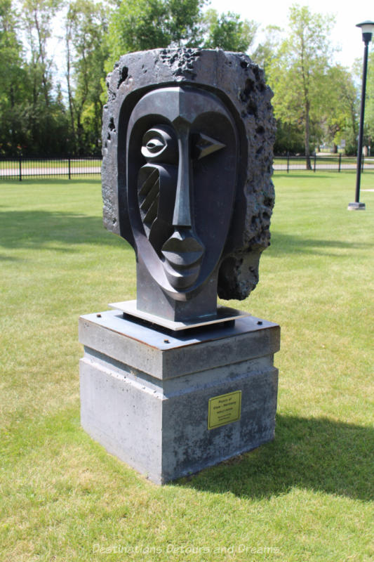 Gallery in the Park" Points of View A sculpture in a park featuring a face with geometric facial features