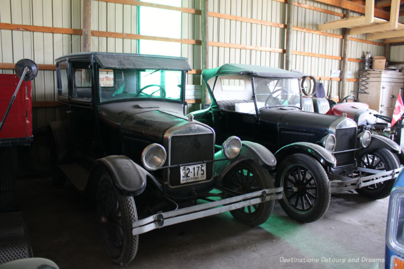 Two black vintage automobiles