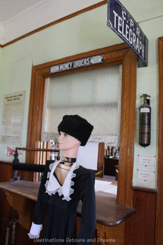 Vintage telegraph booth with mannequin in period dress