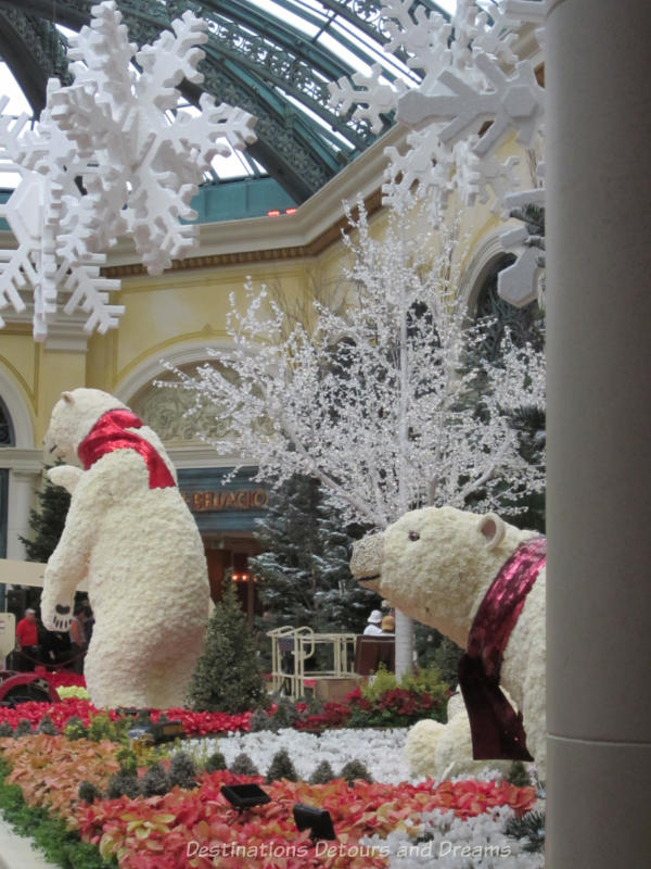 Christmas display featuring two giant polar bears created with flowers in a bed of poinsettias in the Bellagio Hotel in Las Vegas