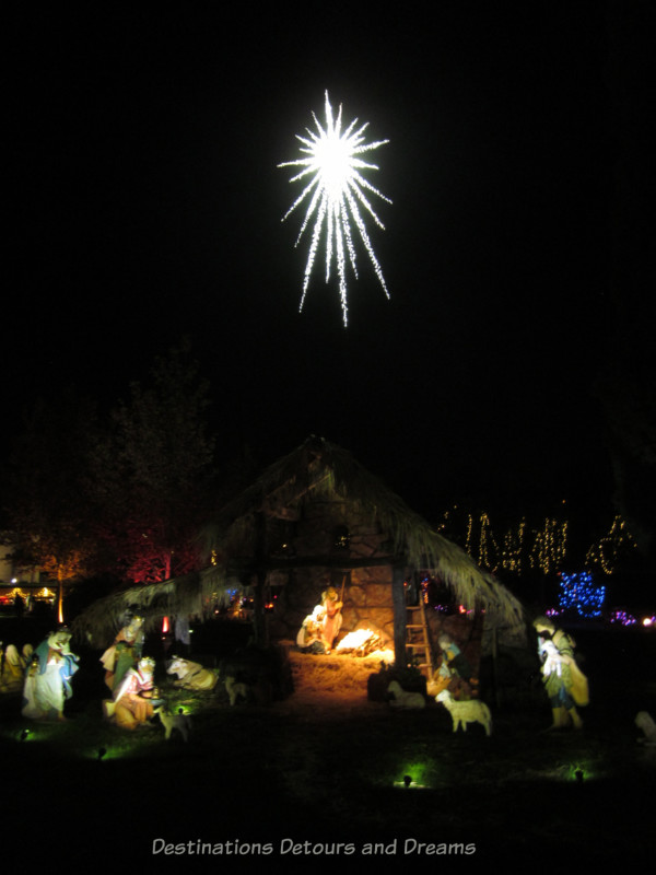 Nativity scene with lighted star above it