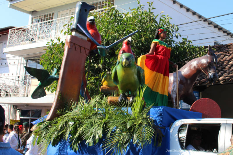 Parade float with woman clad in Pollera Congo dress