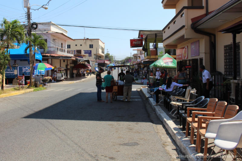 Main street of Las Tablas, Panama with empty chairs lining the sidewalk waiting for the upcoming parade.