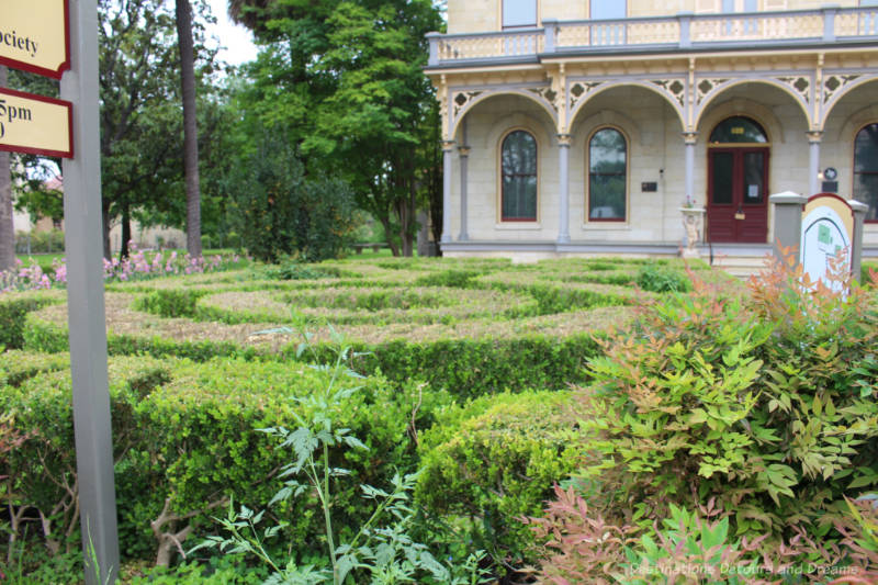 Hedge maze in the front yard of a heritage home