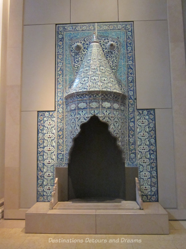 Blue tilework around a chimney on display at V&A