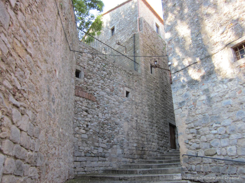 Ancient stone walls and steps of a fortress in Girona