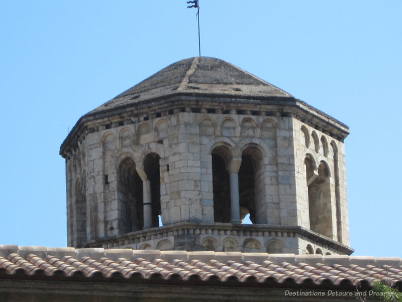 Octagonal stone bell tower atop a monastery in Girona