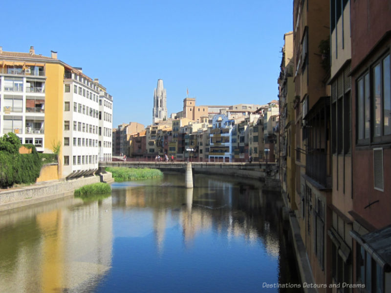 Buildings on either side of the Onyar River in Girona, Spain, with old town architecture on the right and new town on the left