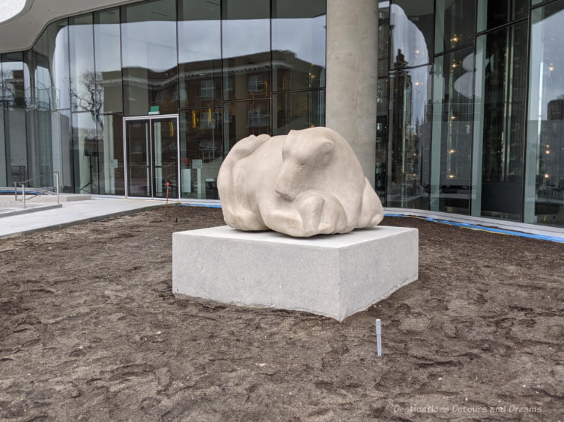 Qaumajuq Time to Play Large stone sculpture of a family of bears called Time to Play by Inuit artist Anghik Ruben