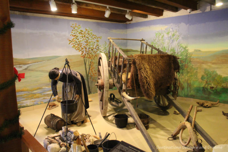 Diorama of a Métis hunting camp, including a replica of a Red River Cart.