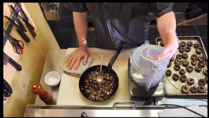 Screen shot of a chef preparing stuffed mushrooms