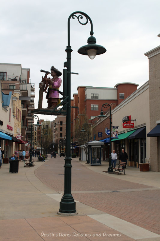 Branson Landing Wide pedestrian street with shops on either side and interesting lamp poles in Branson Landing, Missouri