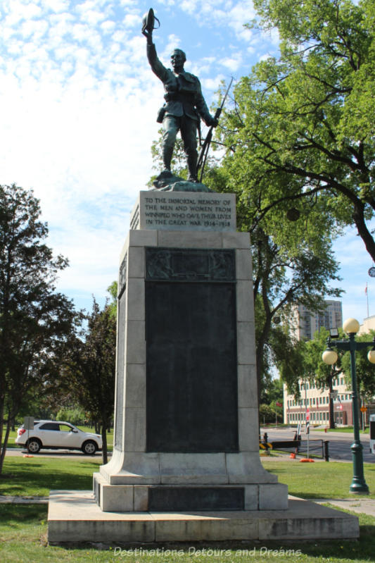 Statue of a soldier holding his helmet in a wave or welcome to remember the Winnipeg lives lost in the Great War