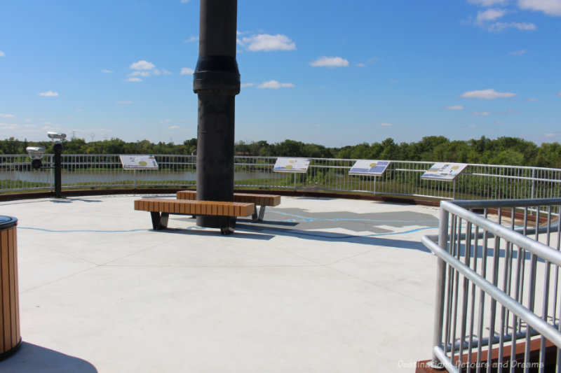 Viewing platform with panels of information overlooking prairie and Red River Floodway