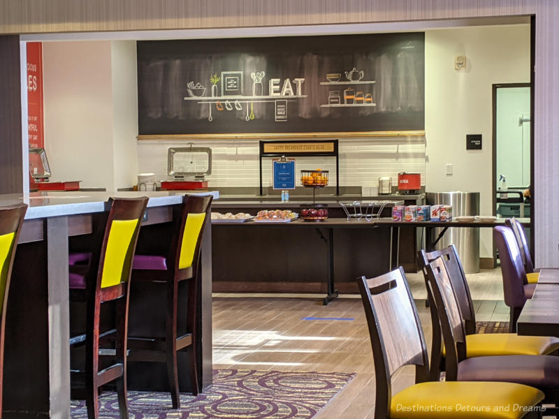 Dining tables and buffet table at a hotel breakfast room