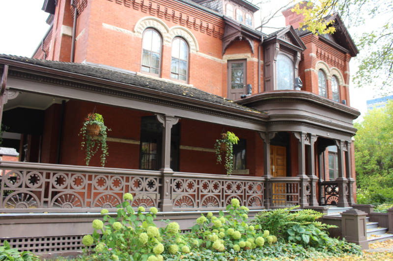 Brick Victorian mansion with wood veranda - Dalnavert Museum