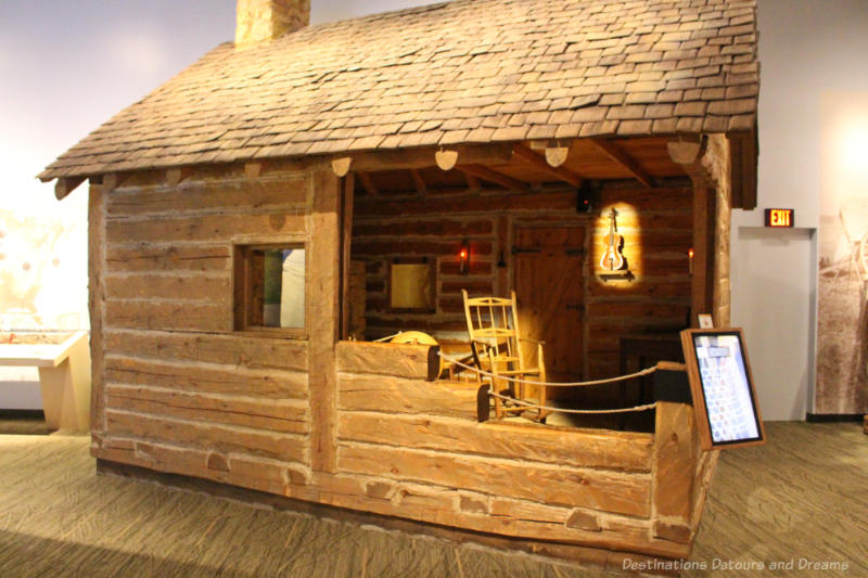 Log cabin museum display cut out to reveal interior