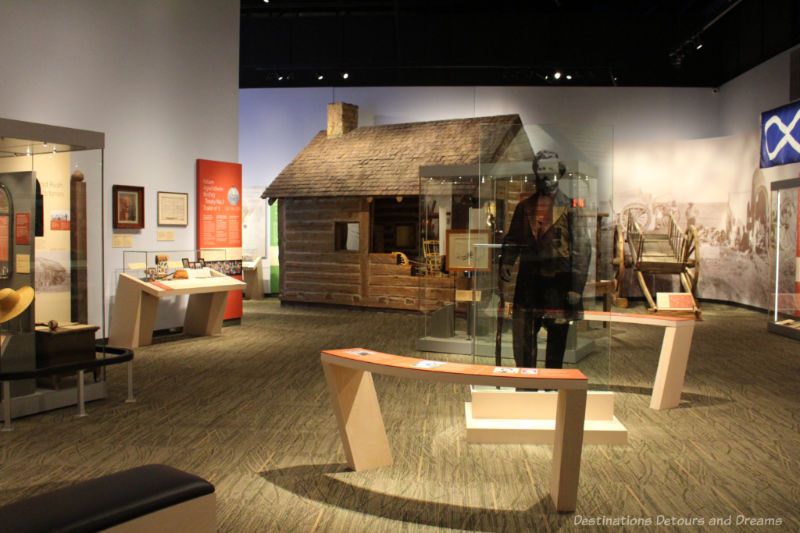 A view of a room of museum displays - Prairies Gallery at Manitoba Museum