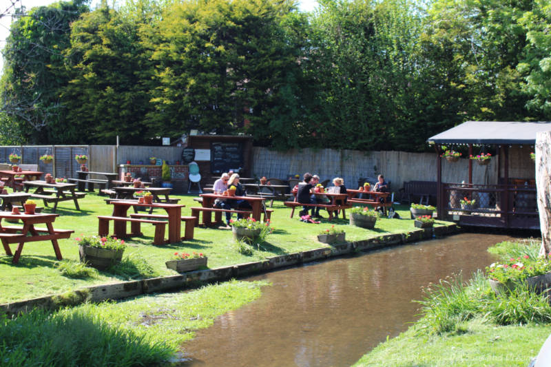 Riverside pub garden with picnic tables