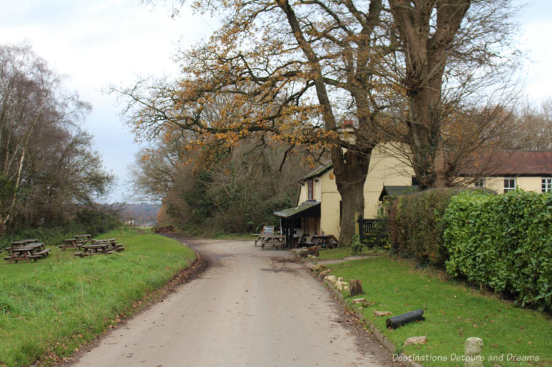 The Sportsman English country road leading to a pub housed in a 16th century royal hunting lodge