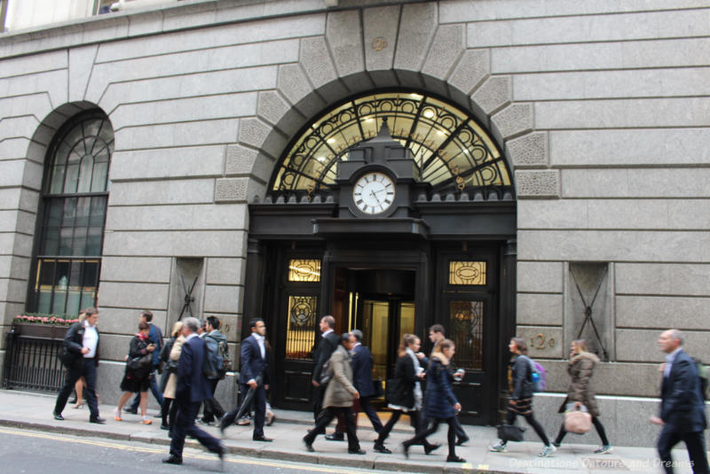 City of London workers rushing down sidewalk at end of working day