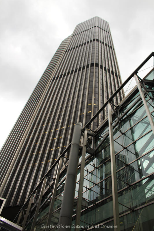 Looking up at the steel and glass skyscraper of Tower 42