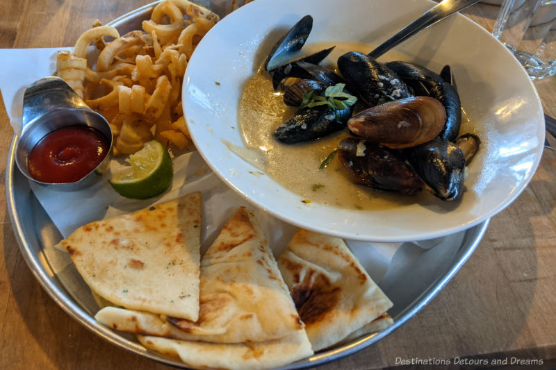 Chili coconut mussels, curly fries, and naan at James Avenue Pumphouse