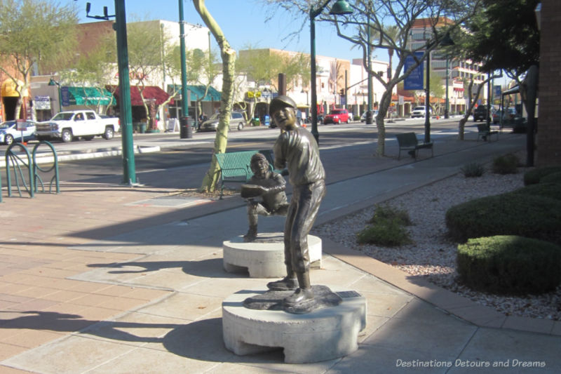 Mesa Big League Dreams Two bronze baseball players, part of Big League Dreams, on display in downtown Mesa