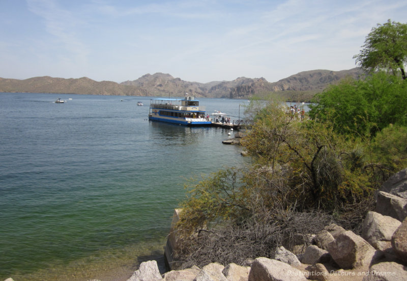 Mesa Desert Belle Two level cruising boat docked at Saguaro Lake surrounded by mountains