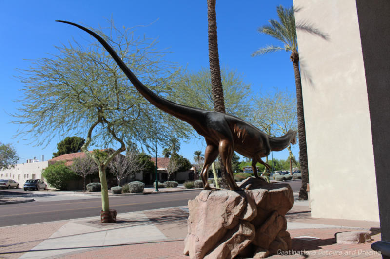 Sculpture of a dinosaur in front of Arizona Museum of Natural History