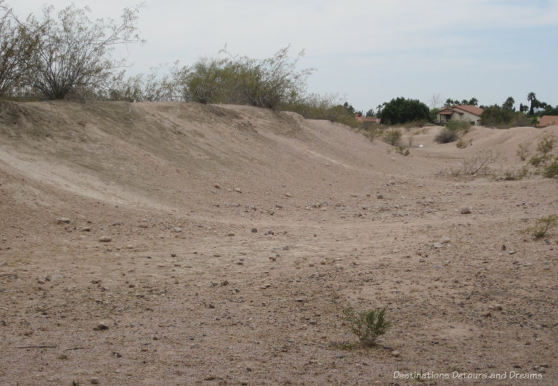 Sandy remains of a Hohokam canal at Park of the Canals in Mesa, Arizona