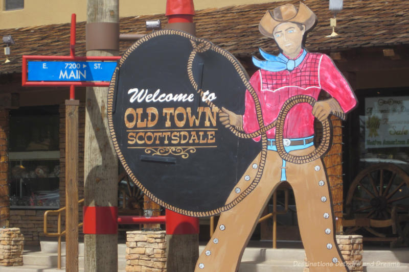 Scottsdale Old Town Life-size cutout of a cowboy roping a sign saying Welcome to Old Town Scottsdale