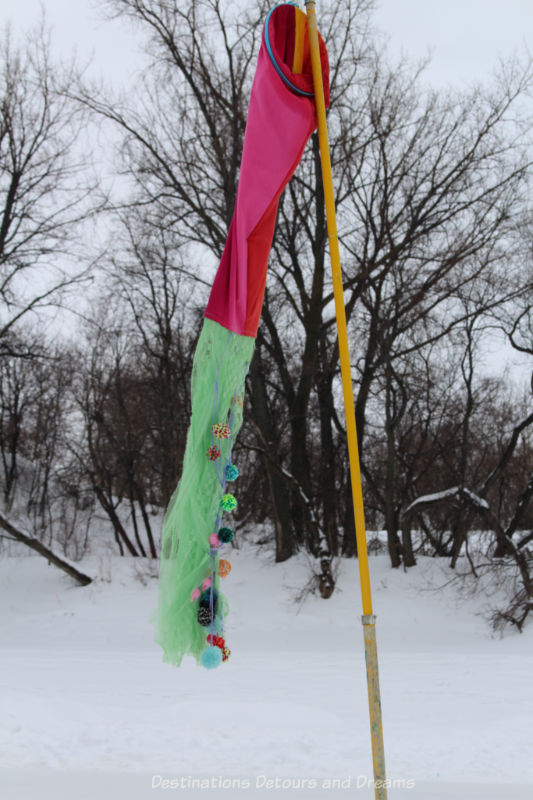 Red and green windsock with assorted hanging balls