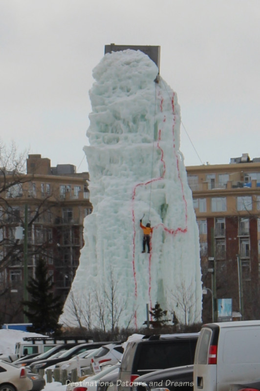 Man climbing an ice tower
