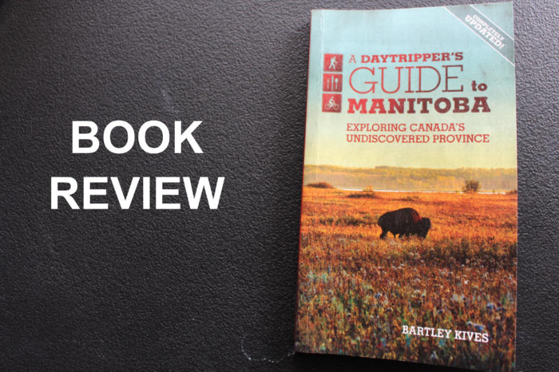 Cover of A Daytripper's Guide to Manitoba aside the words Book Review