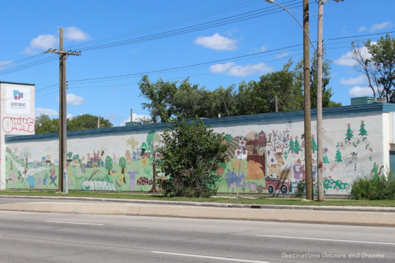 Mural on the side of a building featuring a collage of neighbourhood stories