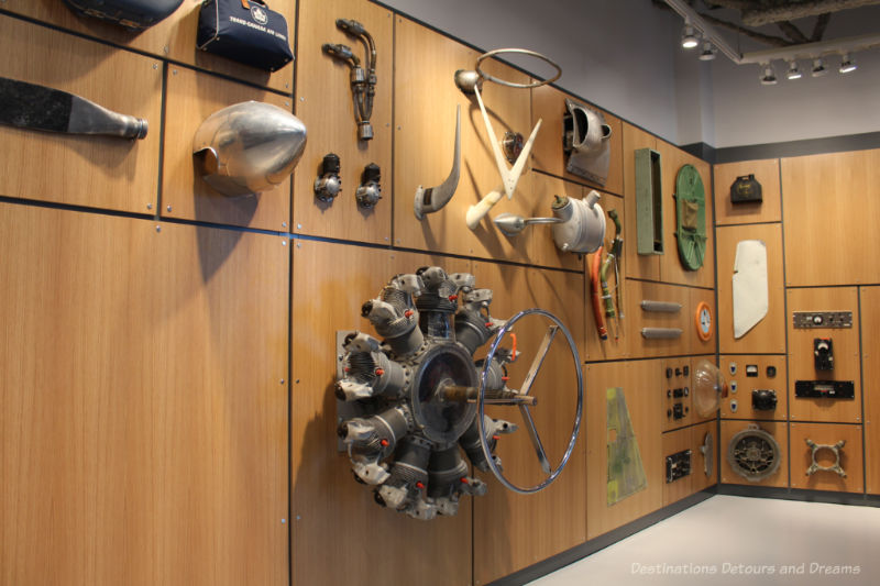 Airplane parts hanging on a wall display at the Royal Aviation Museum of Western Canada