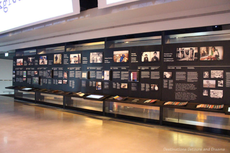 Wall of written and digital displays focusing on turning points for humanity at the CMHR