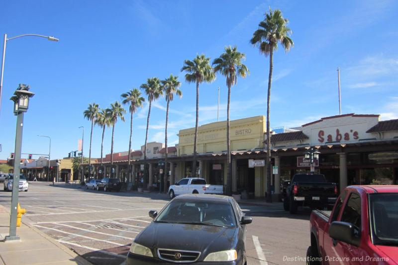 Colourful shops along a palm treel-lined street in downtown Chandler, Arizona