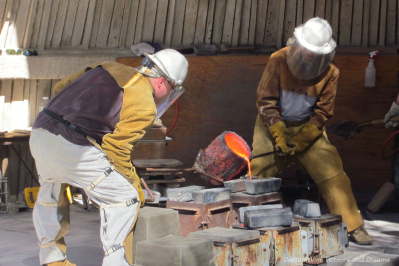 Artisans pouring hot bronze into molds at Cosanti Originals