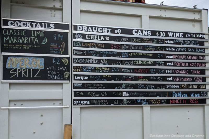 Chalkboard drinks menu featuring many local beers at The Beer Can